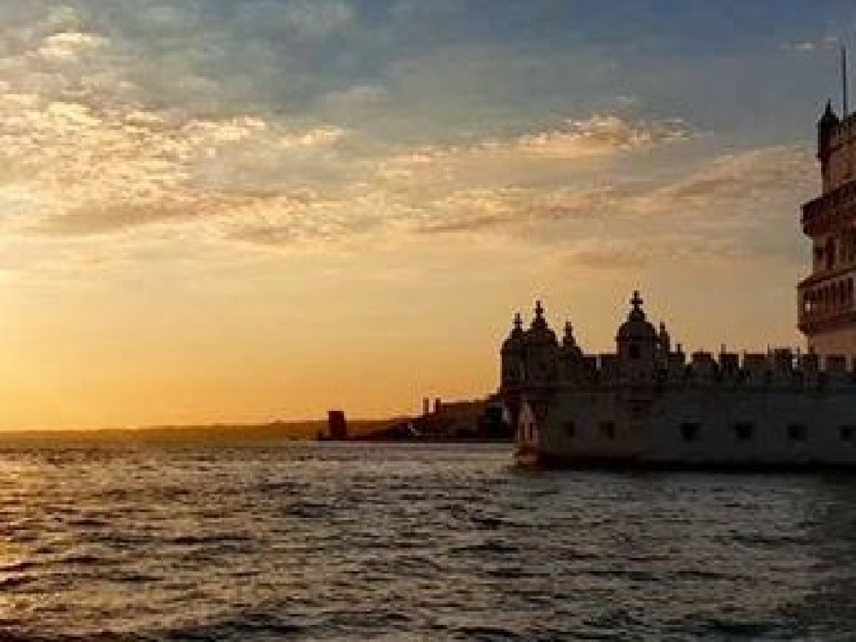 Sunset over Lisbon sea and city